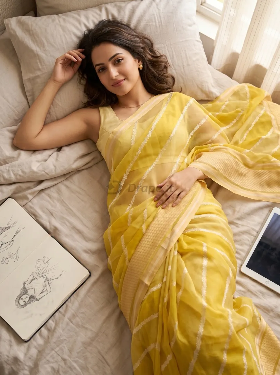 Editorial saree photoshoot — yellow sheer saree in a relaxed indoor setting